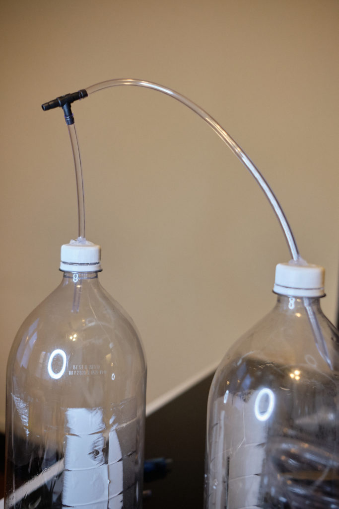 two co2 reactor bottles